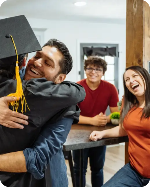 Family celebrating a graduate at home.