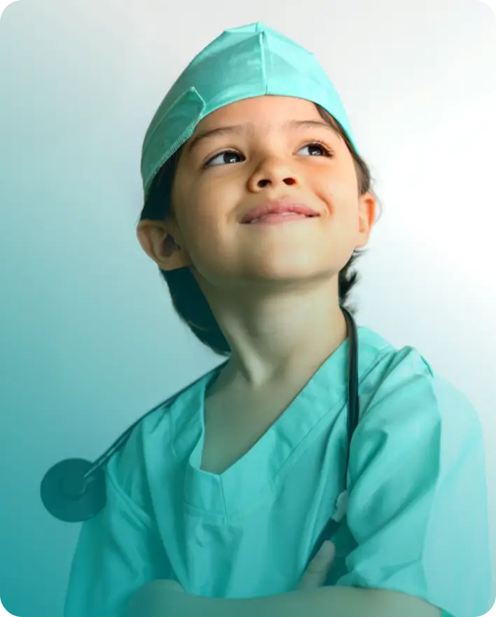 Child dressed as a doctor with scrubs, surgical cap and stethoscope.